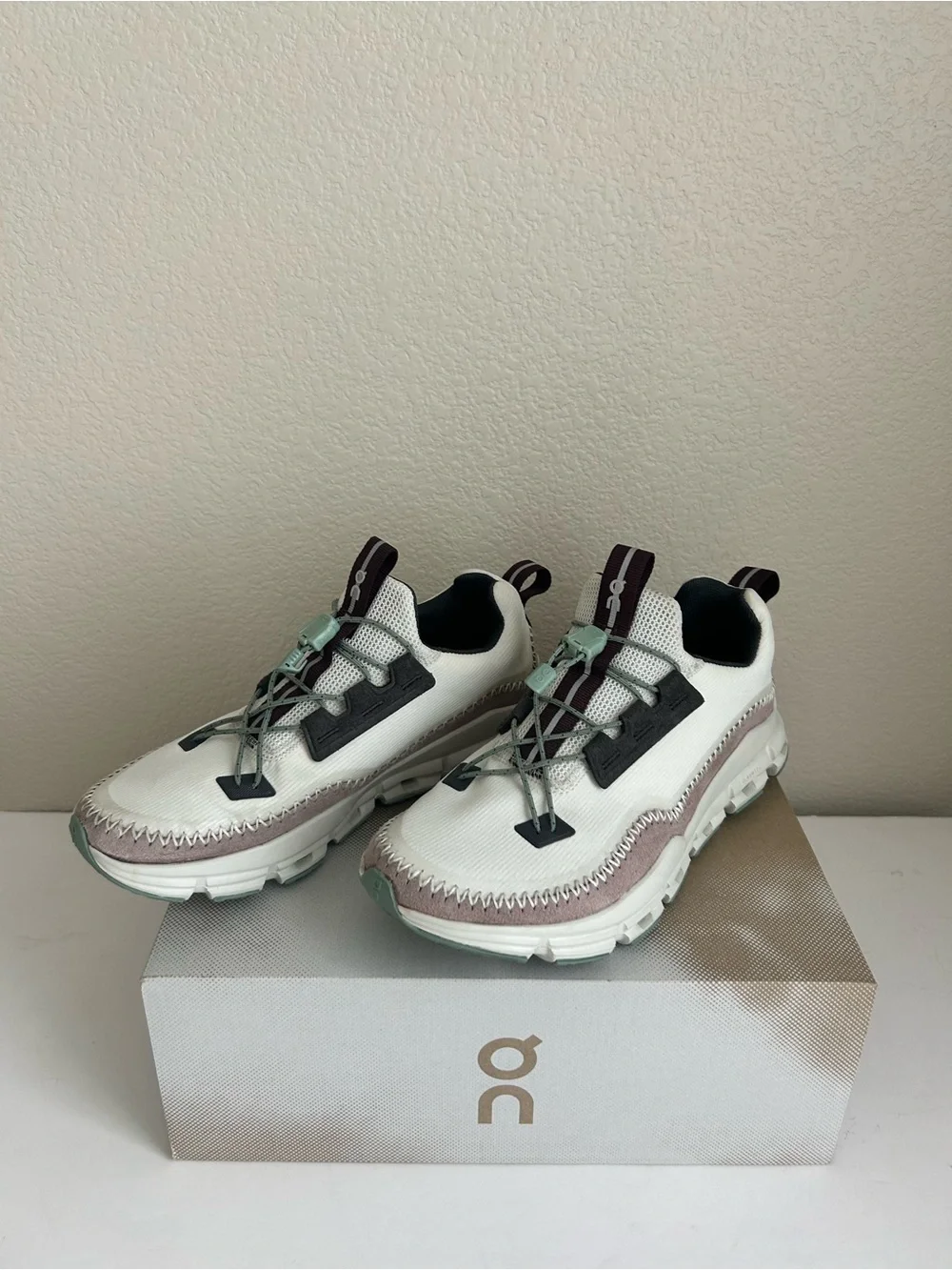 On Running women’s cloudaway Lace-Up Sneakers in White and Light Pink
